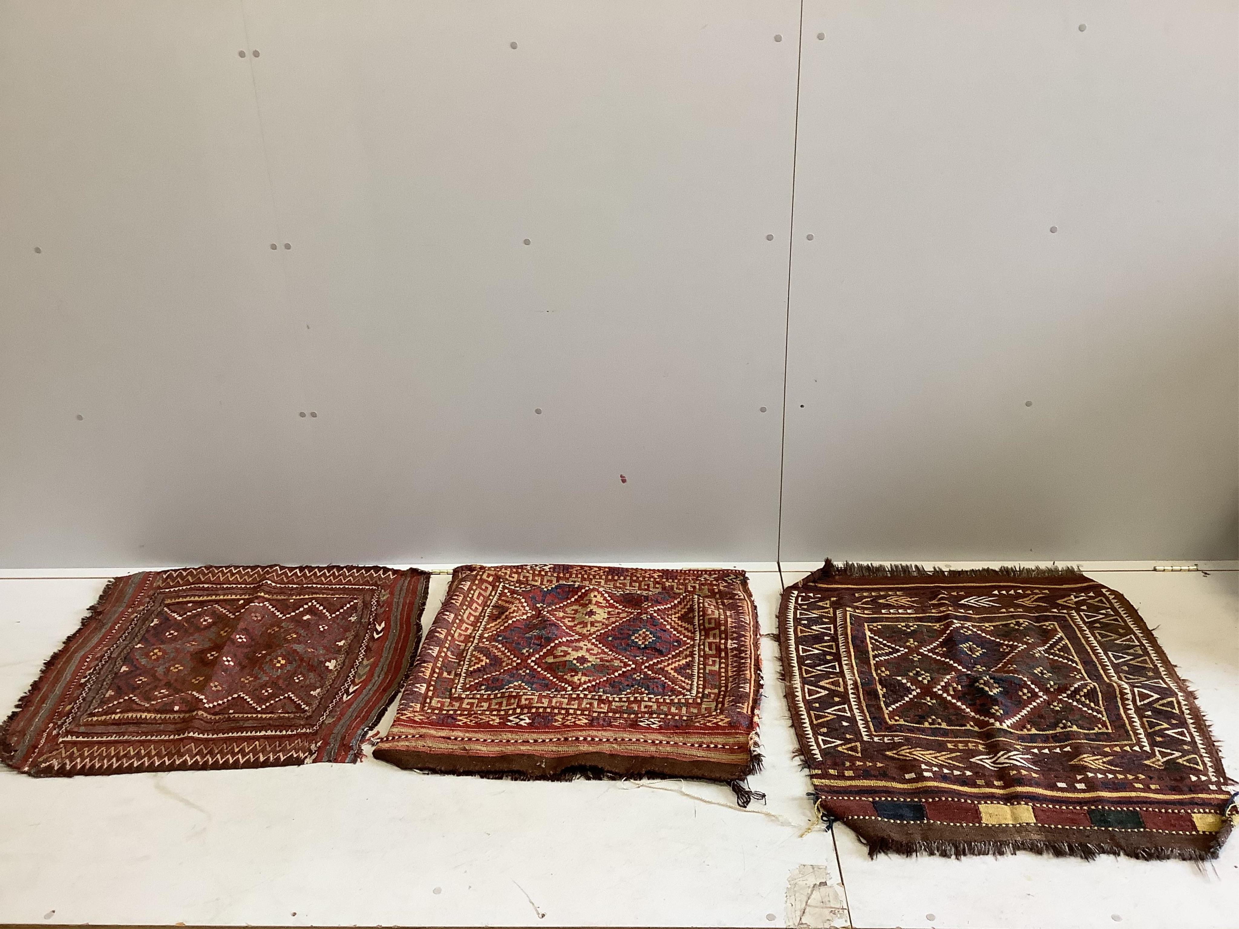 Five Caucasian saddlebags / bag faces and a fabric panel, largest 80 x 95cm. Condition - fair